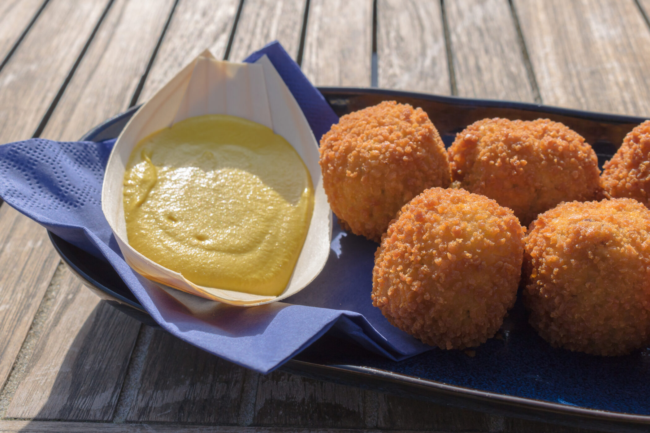 Golden bitterballen with mustard